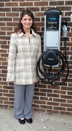 Allessandra standing next to Electric Vehicle Charging Station