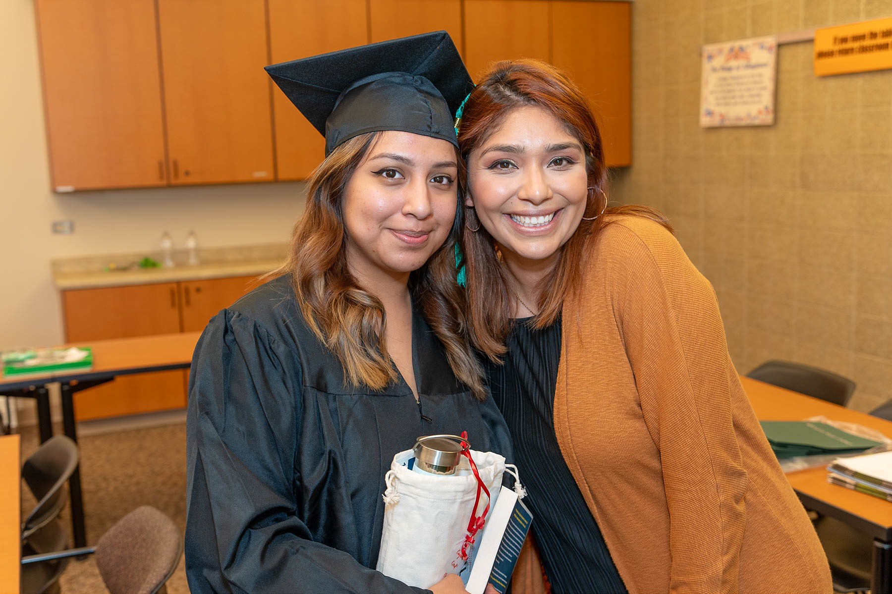 graduate taking picture with advisor