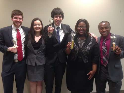 PSC Speech Team Members pose with trophies.
