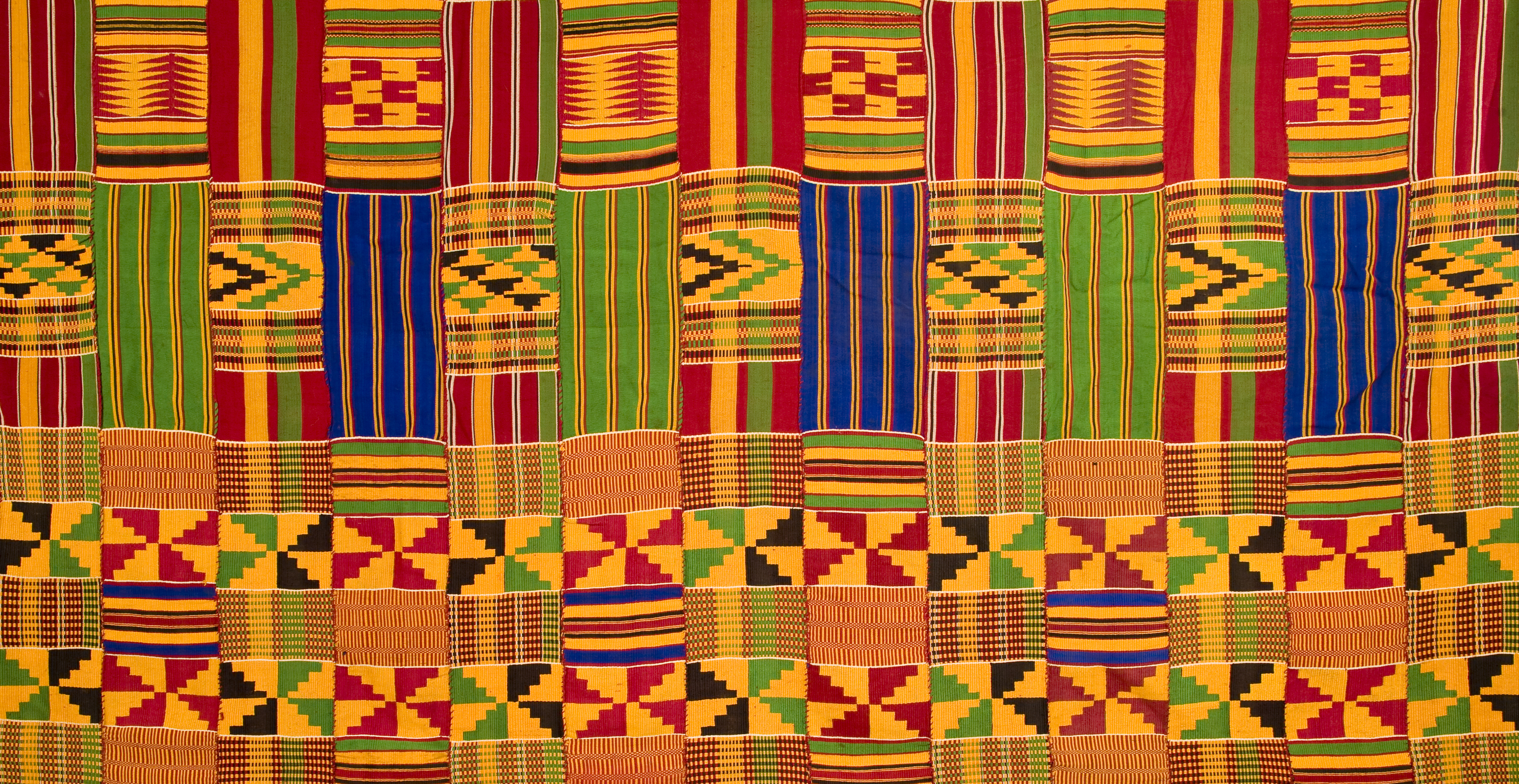 A Kente cloth,  a type of silk and cotton fabric made of interwoven cloth strips made and native to the Akan ethnic group of Ghana.